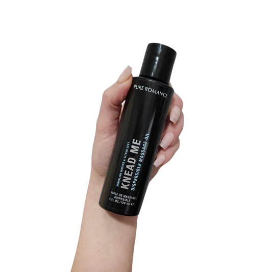 Knead Me - Botanical Non Staining Massage Oil - Pure Romance with flip top pop top lid sparkling waves and citrus zest fragrance www.VALGINA.com