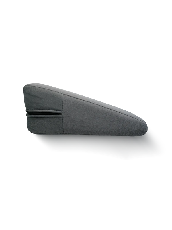 Position Wedge – Support Cushion for Elevated Intimacy. A gray wedge-shaped position wedge cushion with a soft, machine-washable cover. Best Couples sex pillow pure romance www.VALGINA.com