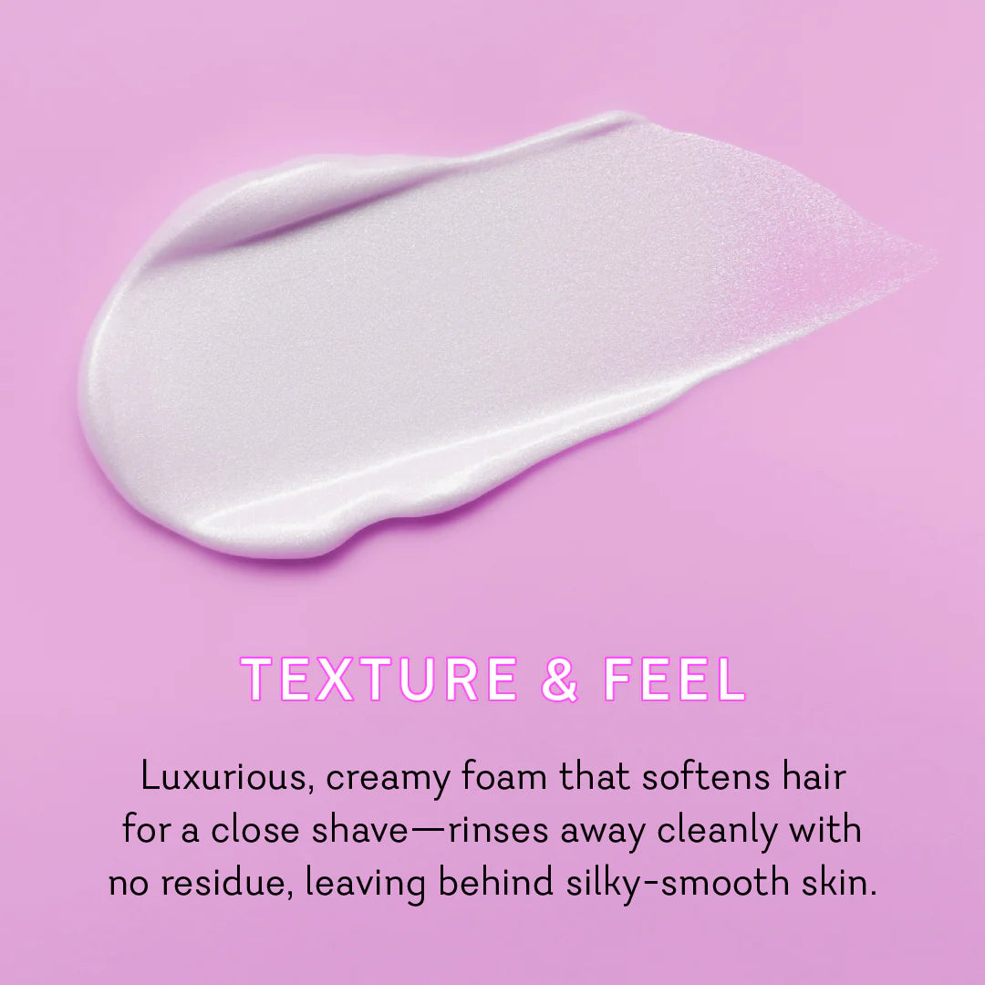 Creamy foam on a pink background with text describing its texture and feel. Vuluxe Coochy Shave Cream Rash free dirty french by pure romance www.VALGINA.com 