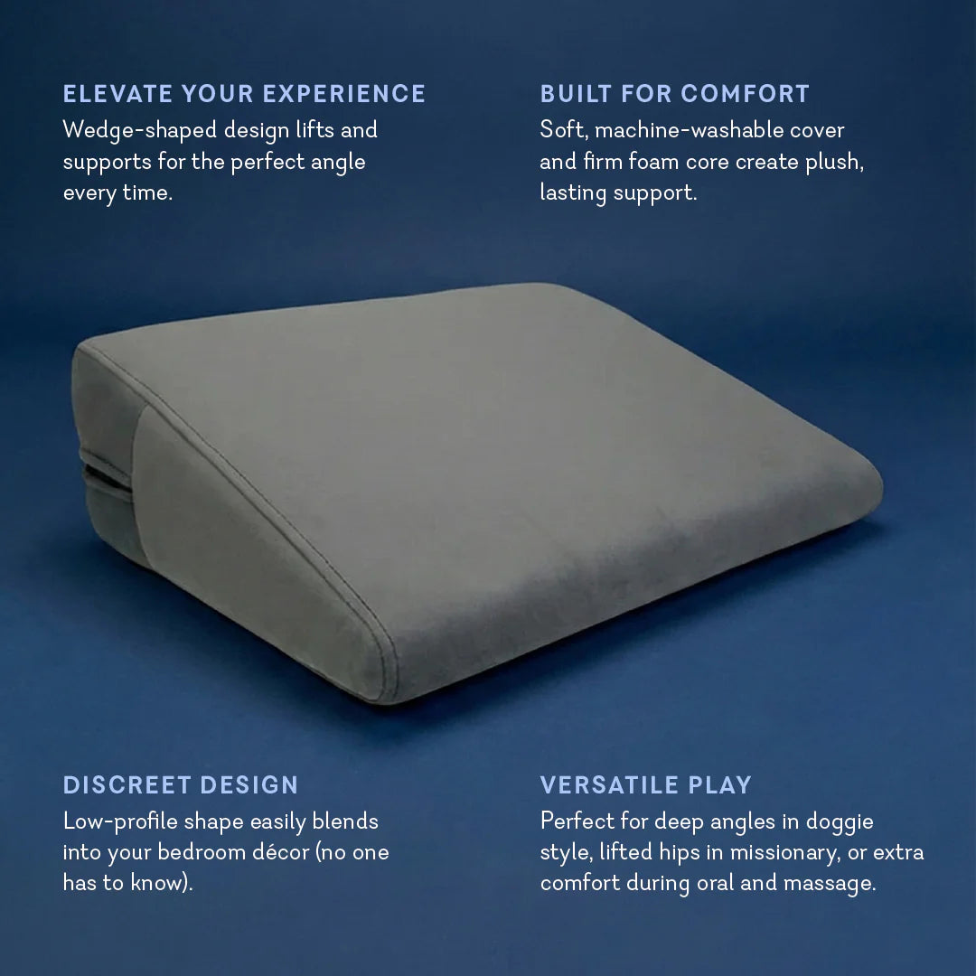 Position Wedge – Support Cushion for Elevated Intimacy. A gray wedge-shaped position wedge cushion with a soft, machine-washable cover. Best Couples sex pillow for positioning www.VALGINA.com 