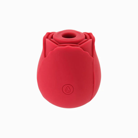 A pink, rosebud-shaped sexual wellness product with a single button on the front. multiple color options hot pink, light pink, red, yellow, glow in the dark green, blue or purple.