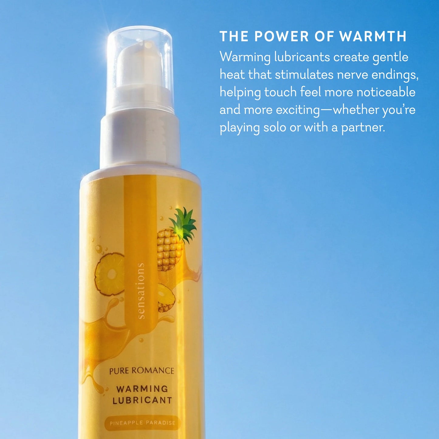 Bottle of Pure Romance warming lubricant with pineapple flavor on a blue background. sensations flavored warming lubricant for oral favors pineapple paradise pure romance www.VALGINA.com 