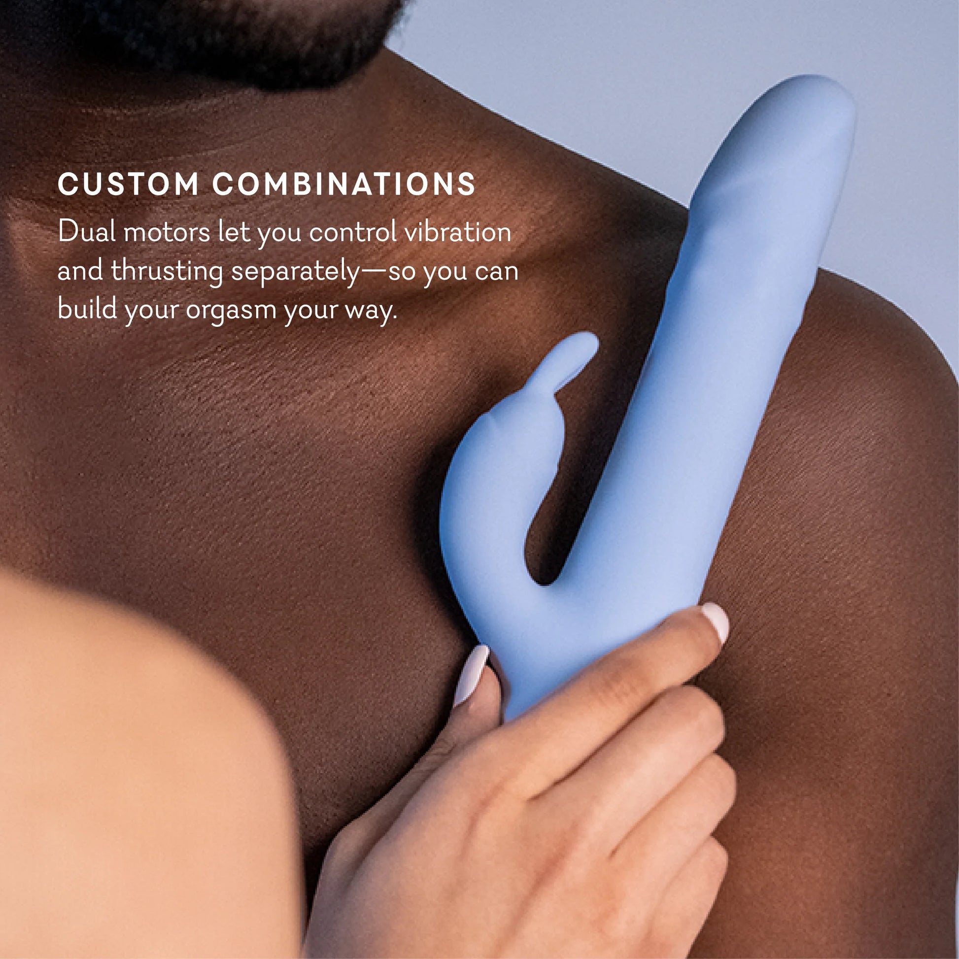 Blue silicone product being held against a person's leg with text about dual motors. t.o.m triple orgasm machine dual rabbit vibrator pure romance www.VALGINA.com 